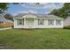 Classic one-story home with a well-kept lawn, complemented by neat gray shutters and fresh exterior at 308 Sandy Knob Ln, Rocky Mount, NC 27803