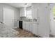 Functional kitchen with white appliances, granite countertops, and ample cabinet space, blending style and convenience at 308 Sandy Knob Ln, Rocky Mount, NC 27803