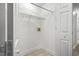 Functional laundry room with shelving, hookups, and neutral flooring, ready for appliances at 308 Sandy Knob Ln, Rocky Mount, NC 27803