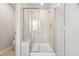 Modern bathroom showcasing walk-in shower with tiled walls and glass door at 3101 Brellon Ln, Durham, NC 27703