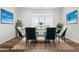 Formal dining room with modern decor, stylish rug, statement chairs, and bright natural light at 3101 Brellon Ln, Durham, NC 27703