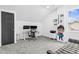 Bedroom equipped with a modern desk setup and a window allowing ample natural light at 320 Chickasaw Plum Dr, Holly Springs, NC 27540