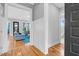 Hallway view into the living room with hardwood floors and open floor plan at 320 Chickasaw Plum Dr, Holly Springs, NC 27540