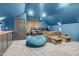 Movie room with comfortable seating, projector, and wet bar, perfect for entertaining friends and Gathering at 320 Chickasaw Plum Dr, Holly Springs, NC 27540