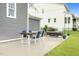 Enjoy outdoor dining on the beautiful back patio with a cozy seating area at 320 Chickasaw Plum Dr, Holly Springs, NC 27540