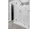 Glass shower with a built-in bench, tile surround, and a dual shower head at 320 Chickasaw Plum Dr, Holly Springs, NC 27540