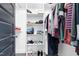 Well-organized walk-in closet with hanging rods, shelving, and custom organizers at 320 Chickasaw Plum Dr, Holly Springs, NC 27540