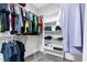 Spacious walk-in closet with shelving and hanging rods for ample storage at 320 Chickasaw Plum Dr, Holly Springs, NC 27540