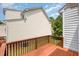 Wooden back deck featuring wood railings, a view of the yard, and home's siding at 33 Grapevine Trl, Durham, NC 27707