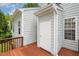 Wooden back deck with access to the outside and view of the home's exterior at 33 Grapevine Trl, Durham, NC 27707