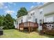 View of a backyard with grass, multiple decks, and siding from the home at 33 Grapevine Trl, Durham, NC 27707