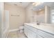 White bathroom with tub/shower combination and single sink at 33 Grapevine Trl, Durham, NC 27707