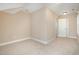 Neutral bedroom featuring carpeted floors, ample wall space, and closet for storage at 33 Grapevine Trl, Durham, NC 27707