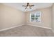 Bedroom featuring neutral walls, ceiling fan, and a window with blinds at 33 Grapevine Trl, Durham, NC 27707