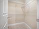 Walk-in closet with carpet and white wire shelving for organized storage at 33 Grapevine Trl, Durham, NC 27707