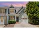 Charming home exterior showcasing garage, well-manicured lawn, and inviting entryway at 33 Grapevine Trl, Durham, NC 27707