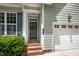Charming home with a brick staircase leading up to a lovely door and garage at 33 Grapevine Trl, Durham, NC 27707