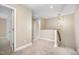 Upstairs hallway with carpeted floors and recessed lighting at 33 Grapevine Trl, Durham, NC 27707