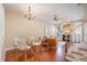Bright and open living space featuring a dining area, living room, and staircase, creating a harmonious flow for modern living at 33 Grapevine Trl, Durham, NC 27707