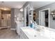 Bathroom featuring double sinks, a shower, and a separate dressing area at 333 Bald Head Island Dr, Garner, NC 27529