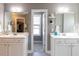Bathroom with double sinks, vanity and mirrors with tile flooring at 333 Bald Head Island Dr, Garner, NC 27529