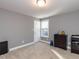 Simple bedroom with neutral carpeting, dark wood dresser, and a window at 333 Bald Head Island Dr, Garner, NC 27529