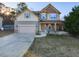 Charming two-story home featuring a two-car garage, inviting front porch, and a well-maintained lawn at 333 Bald Head Island Dr, Garner, NC 27529