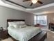 Spacious main bedroom with a tray ceiling, large bed, and bright windows at 333 Bald Head Island Dr, Garner, NC 27529