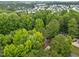 Stunning aerial view of the neighborhood with lush greenery and charming homes nestled among the trees at 3608 Meadow Creek Ln, Raleigh, NC 27616
