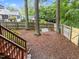 Serene backyard featuring a wooden swing, lush trees, and a charming stairway to outdoor at 3608 Meadow Creek Ln, Raleigh, NC 27616