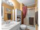 Cozy bathroom featuring a shower with glass doors, a vanity with storage, and neutral tones at 3608 Meadow Creek Ln, Raleigh, NC 27616