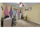 Office space with unique accent walls, a computer desk, and a comfortable rolling chair at 3608 Meadow Creek Ln, Raleigh, NC 27616