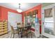 Cozy dining area featuring a glass table, wicker chairs, and easy access to the back deck at 3608 Meadow Creek Ln, Raleigh, NC 27616