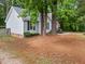 Quaint single-Gathering home with neat landscaping, a cozy front porch, and a welcoming facade at 3608 Meadow Creek Ln, Raleigh, NC 27616