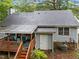 Rear exterior of the home showcasing siding, roof, deck, and well-maintained landscaping at 3608 Meadow Creek Ln, Raleigh, NC 27616