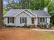 Charming single-story home featuring a cozy front porch, neat landscaping, and a welcoming facade at 3608 Meadow Creek Ln, Raleigh, NC 27616