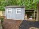 Well-maintained storage shed with double windows, perfect for storing tools and equipment at 3608 Meadow Creek Ln, Raleigh, NC 27616