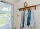 Charming entryway with decorative shelf and view of the front porch at 403 Rolling Rd, Haw River, NC 27258