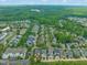 Expansive aerial view of a neighborhood with charming homes, mature trees, and well-maintained streets in a community setting at 404 S Camellia St, Chapel Hill, NC 27516