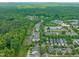 An aerial view showcasing the community's layout near lush green spaces, featuring charming homes and tree-lined streets at 404 S Camellia St, Chapel Hill, NC 27516