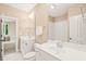 Bathroom featuring dual vanity and bath shower combo at 404 S Camellia St, Chapel Hill, NC 27516