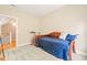 Bedroom featuring a daybed, exercise bike, carpeted floors, and natural light from the window at 404 S Camellia St, Chapel Hill, NC 27516