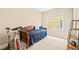 Bedroom featuring a daybed, exercise bike, carpeted floors, and natural light from the window at 404 S Camellia St, Chapel Hill, NC 27516