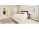 Comfortable bedroom with a cozy bed and a window offering natural light at 404 S Camellia St, Chapel Hill, NC 27516