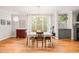 Elegant dining room featuring a modern light fixture and bright windows at 404 S Camellia St, Chapel Hill, NC 27516