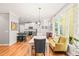 Bright dining room with modern lighting and a view of the kitchen area at 404 S Camellia St, Chapel Hill, NC 27516