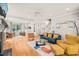 Spacious living room filled with natural light, hardwood floors, and stylish decor at 404 S Camellia St, Chapel Hill, NC 27516