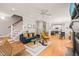 Inviting living room showcasing an open floor plan, staircase and hardwood floors at 404 S Camellia St, Chapel Hill, NC 27516