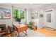 Comfortable home office with a large window, hardwood floors, and modern decor at 404 S Camellia St, Chapel Hill, NC 27516