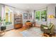 Comfortable home office with a large window, hardwood floors, and modern decor at 404 S Camellia St, Chapel Hill, NC 27516
